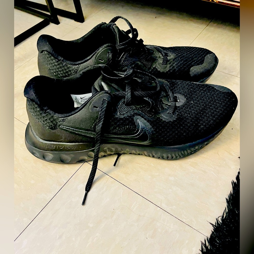 Nike all-black men’s running sneakers.